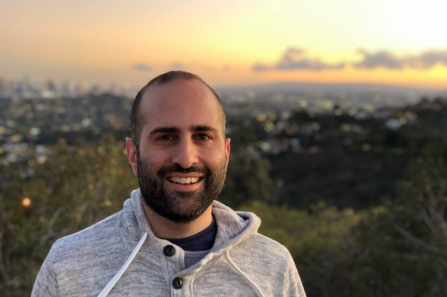 ErErik Yesayan with sunset and view in the background