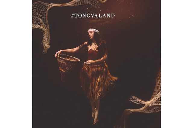 Billboard of woman holding basket underwater 