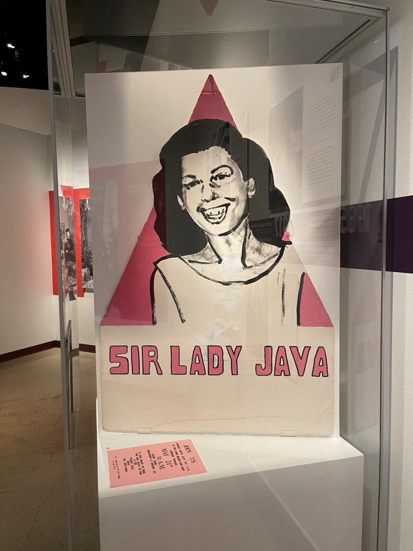 Poster depicting Sir Lady Java on display at museum 